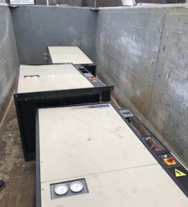 Old chillers in dumpster