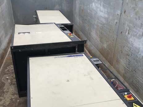 Old chillers in dumpster